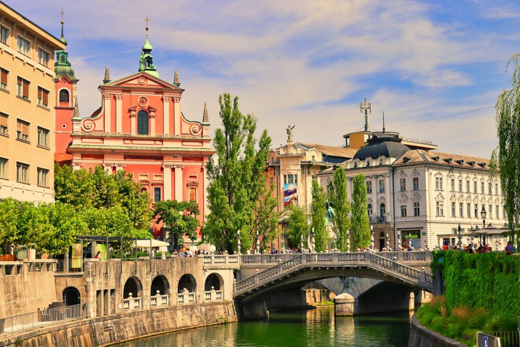 a bridge over a body of water in a city